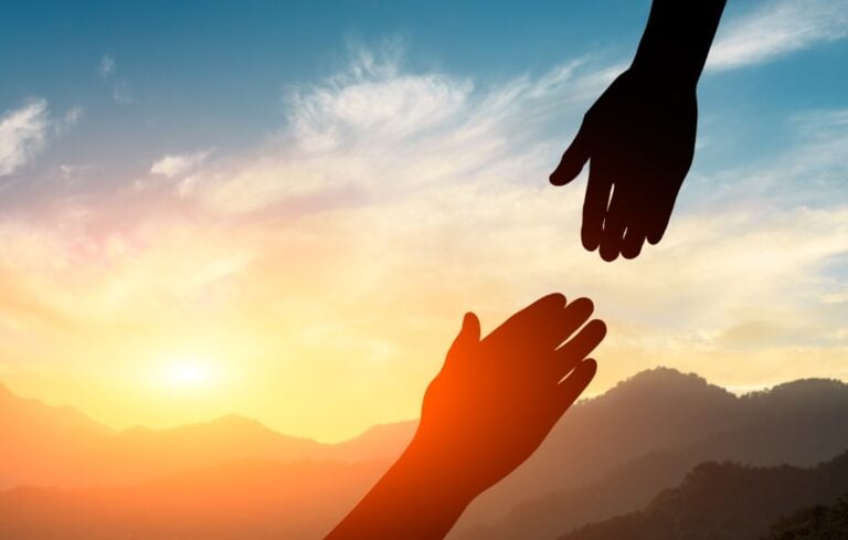 helping hand with the sky sunset background