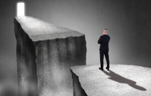 Man needing to get past chasm to opportunity