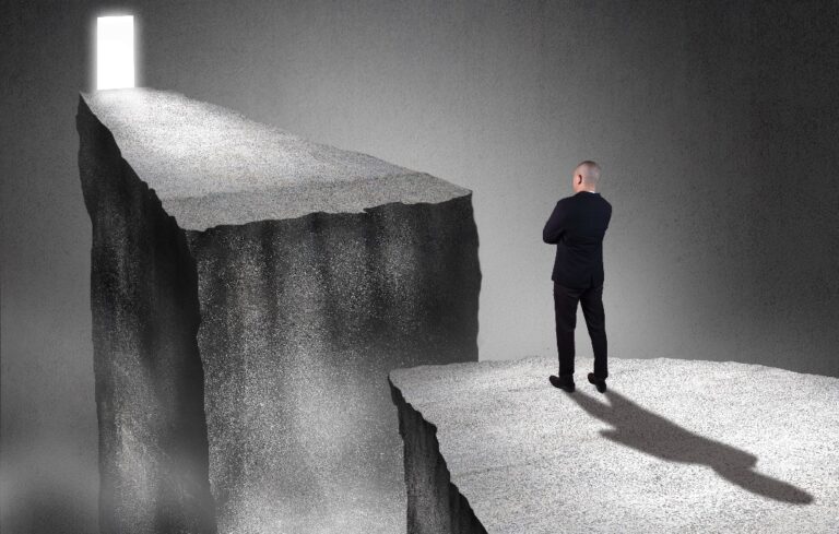 Man needing to get past chasm to opportunity
