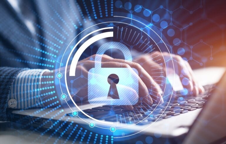 Image of lock overlayed man typing on laptop